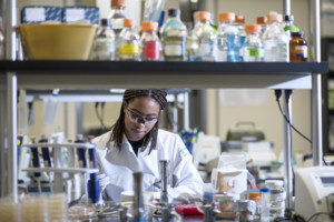 UCI Student conducts research in a lab inclusive excellence