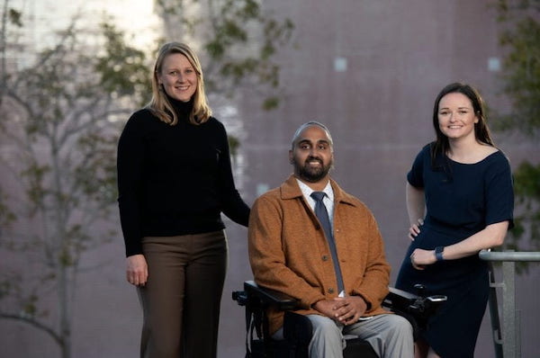 Image of UCI medical students Anna Rasmussen, Hinesh Patel and Kate Boudreau smiling together