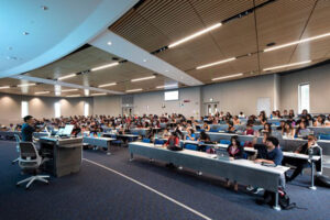 Matthew Mahavongtrakul teaches his molecular biology class in the 200-seat auditorium at the ALP. photo: Steve Zylius/UCI